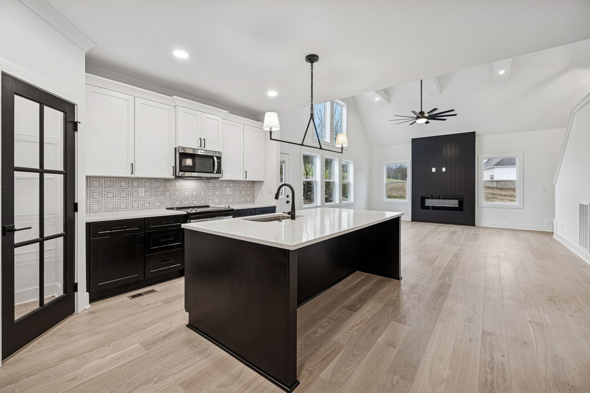 1501 Opossum Paw Road Beechgrove, TN 37018 - Photo 17 of 55 a kitchen with stainless steel appliances kitchen island granite countertop a refrigerator a sink dishwasher and a stove with wooden floor