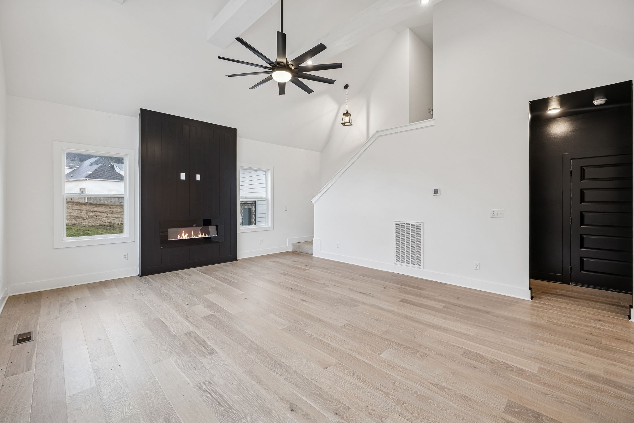 1501 Opossum Paw Road Beechgrove, TN 37018 - Photo 19 of 55 a view of a livingroom with a fireplace and wooden floor