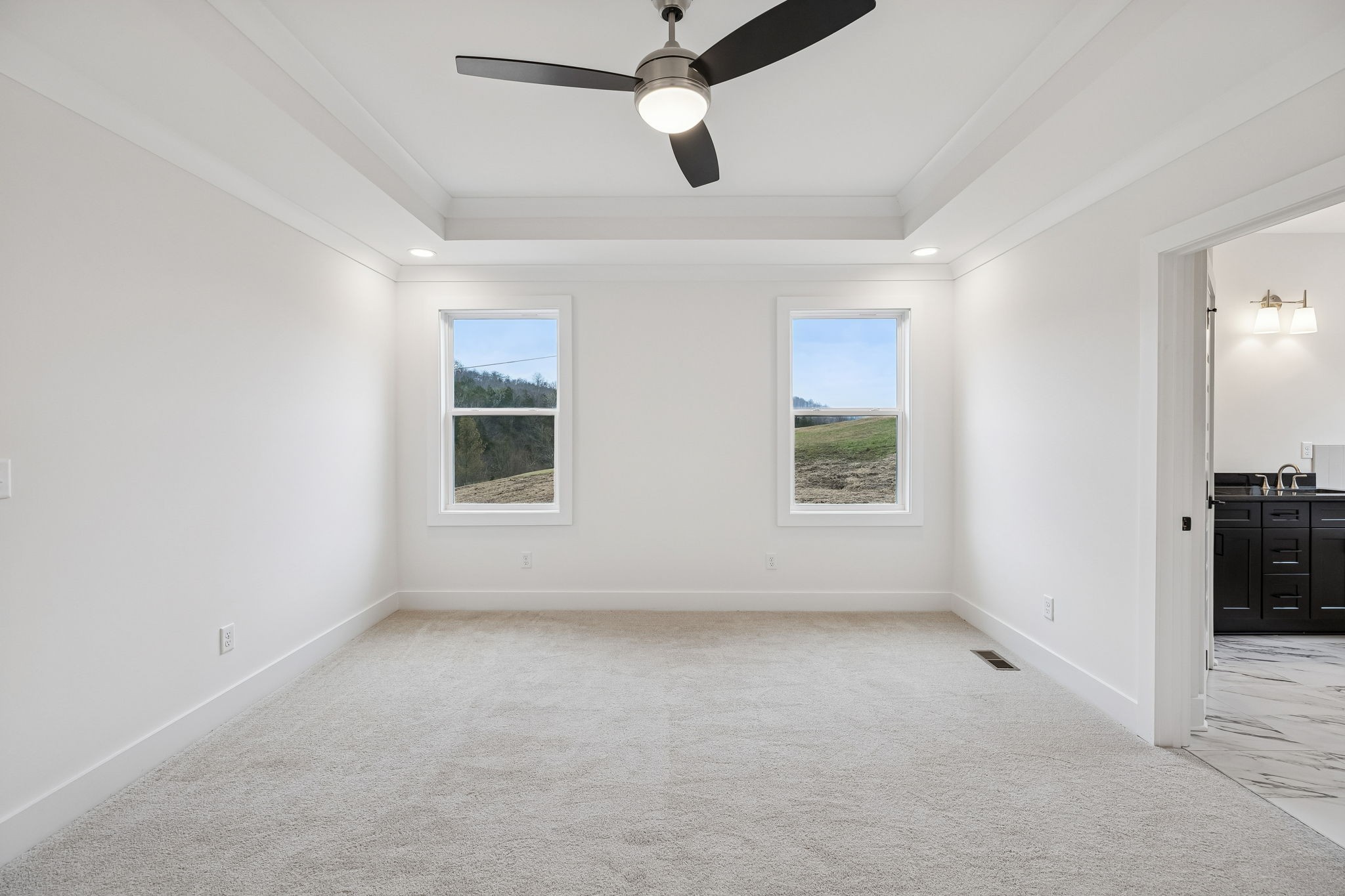 1501 Opossum Paw Road Beechgrove, TN 37018 - Photo 30 of 55 an empty room with ceiling fan and window