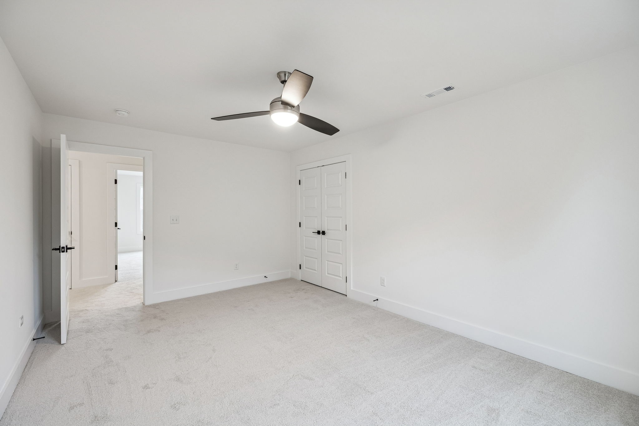 1501 Opossum Paw Road Beechgrove, TN 37018 - Photo 43 of 55 an empty room with a ceiling fan and a window