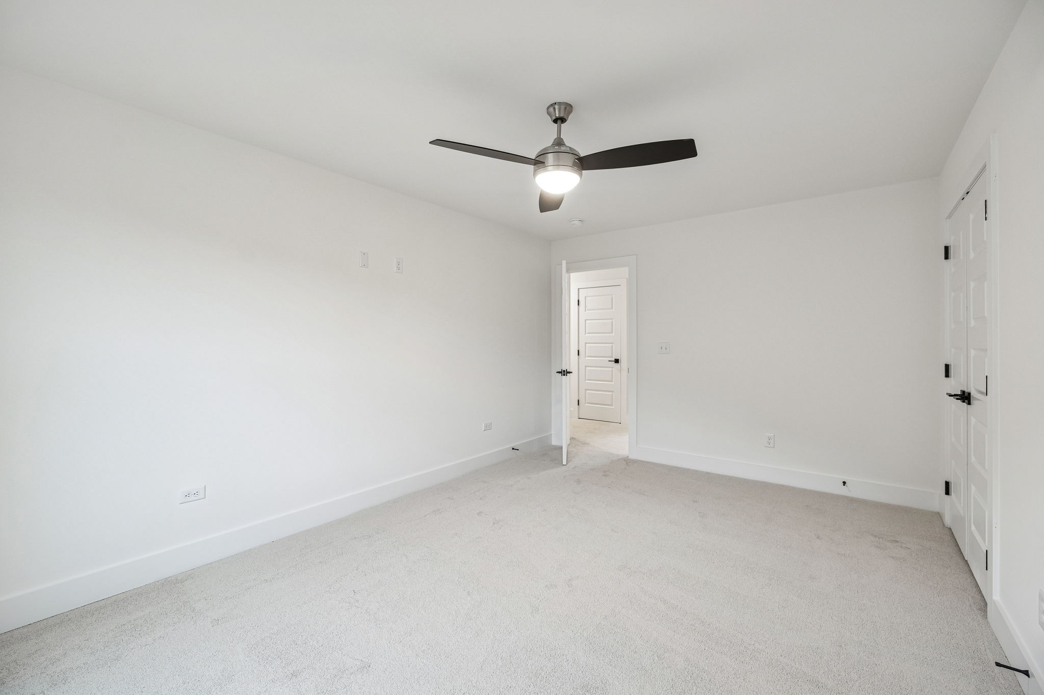 1501 Opossum Paw Road Beechgrove, TN 37018 - Photo 44 of 55 an empty room with a ceiling fan and carpet