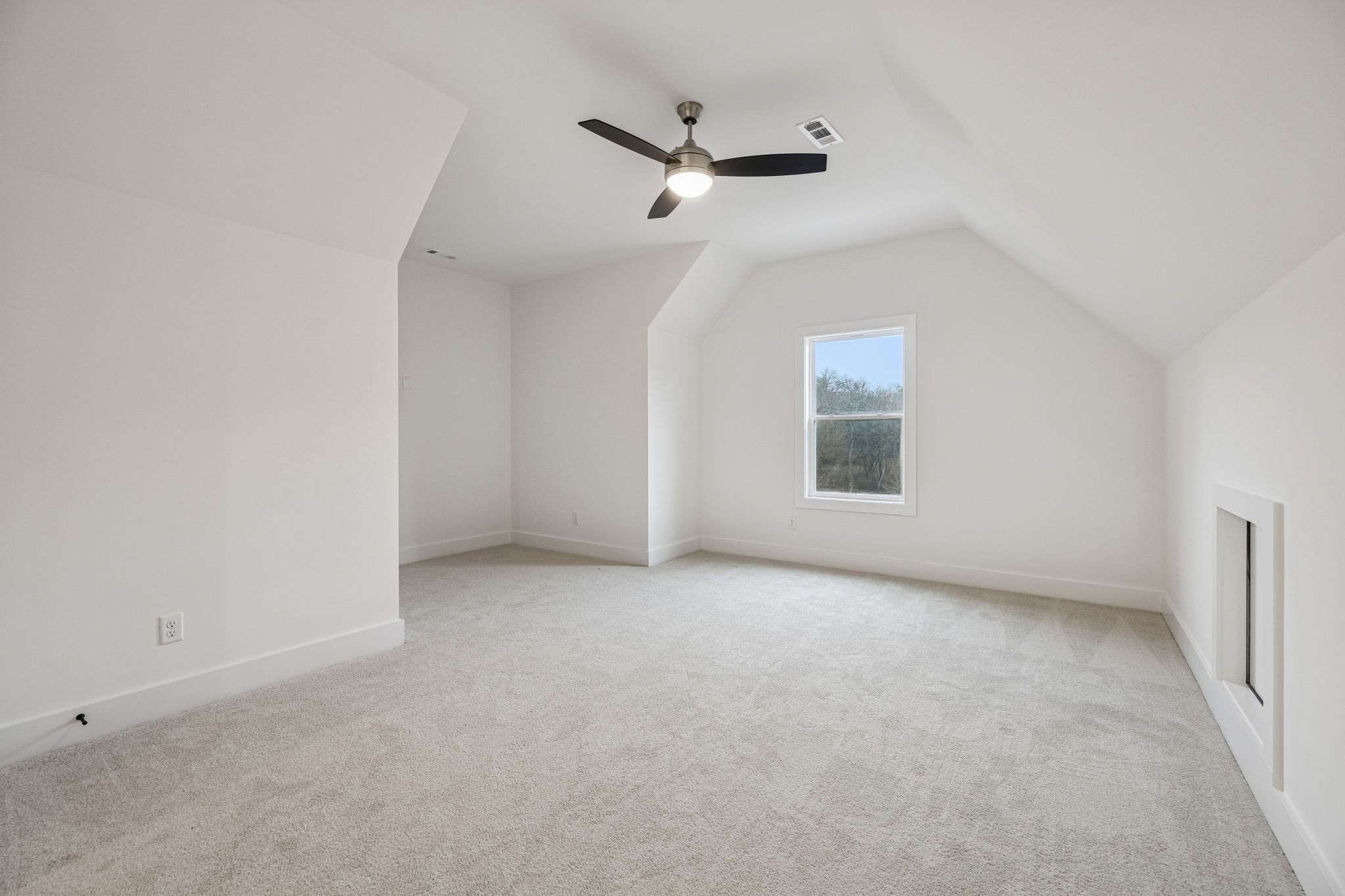 1501 Opossum Paw Road Beechgrove, TN 37018 - Photo 49 of 55 an empty room with a ceiling fan and window