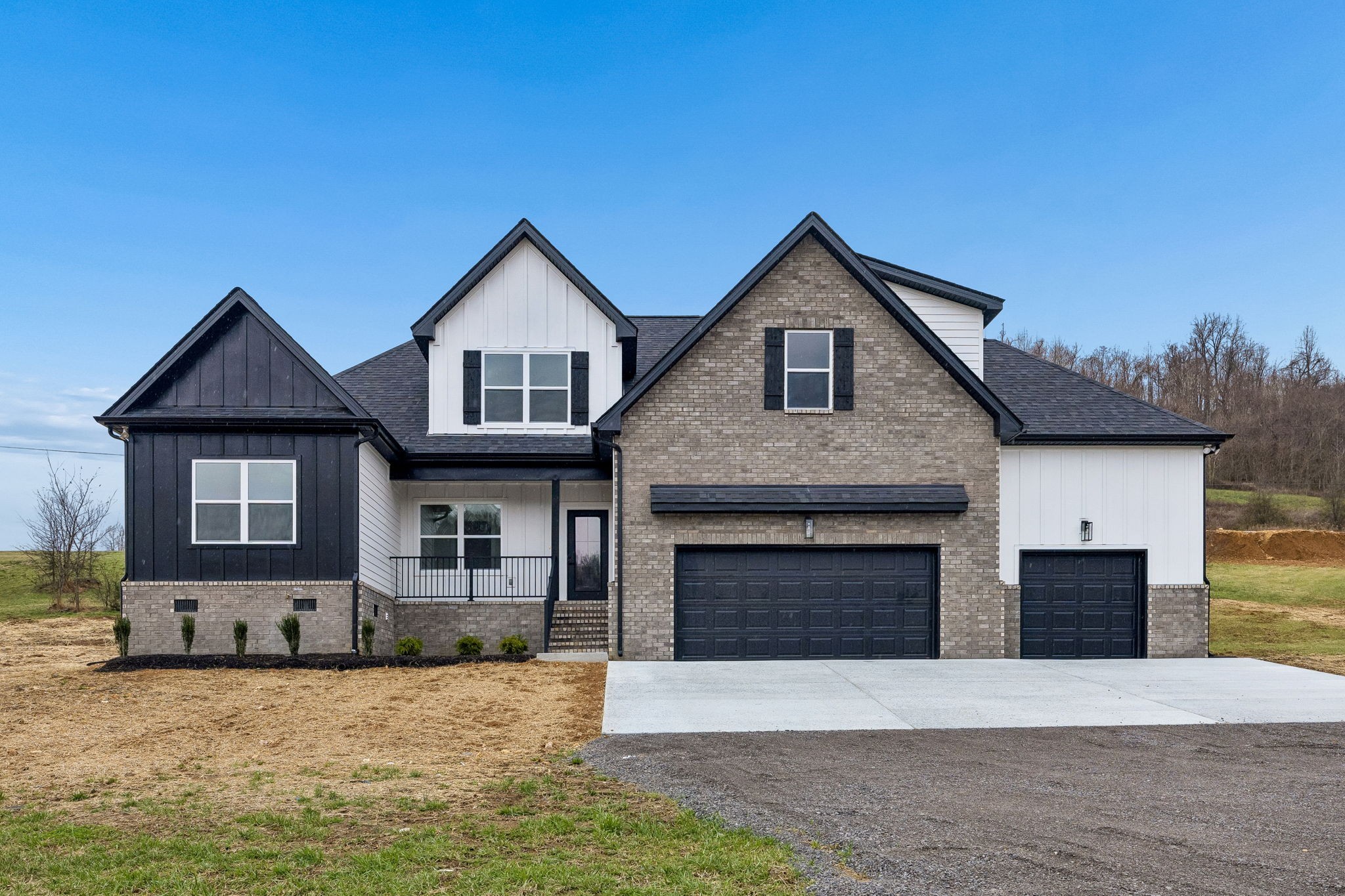 1501 Opossum Paw Road Beechgrove, TN 37018 - Photo 7 of 55 a front view of a house with yard and garage