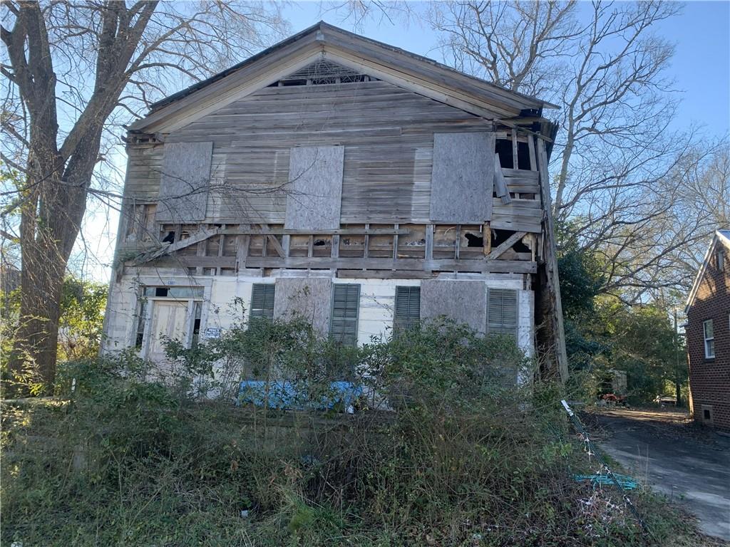 256 Maiden Lane Sparta, GA 31087 - Photo 7 of 7 a front view of a house with a yard