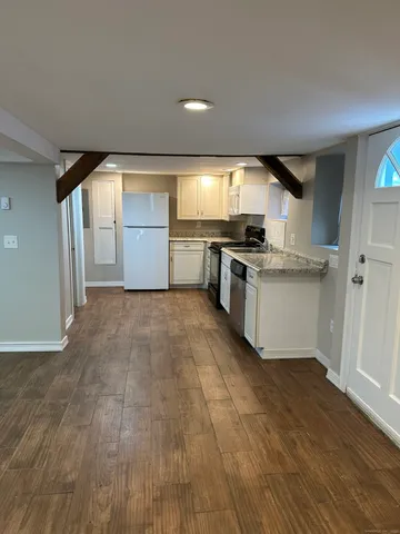 a kitchen with stainless steel appliances granite countertop a stove and a sink