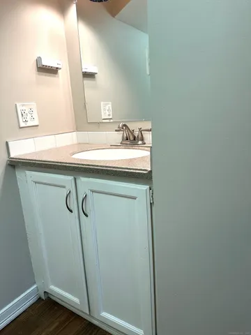 a bathroom with a sink and mirror