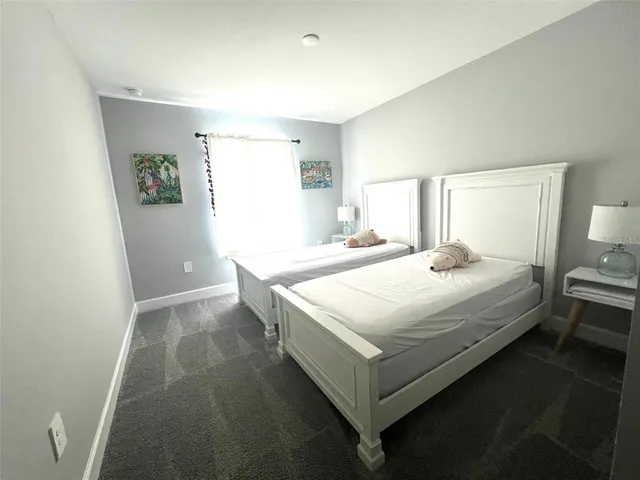 a bedroom with a bed and a table