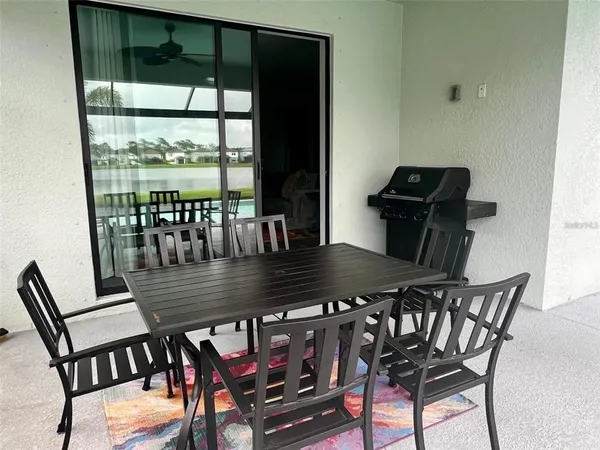a dining room with furniture and wooden floor