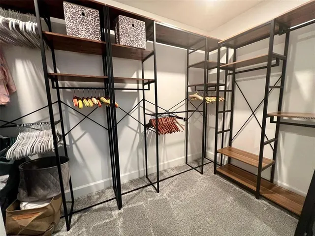 a spacious bathroom with a double vanity sink and a mirror