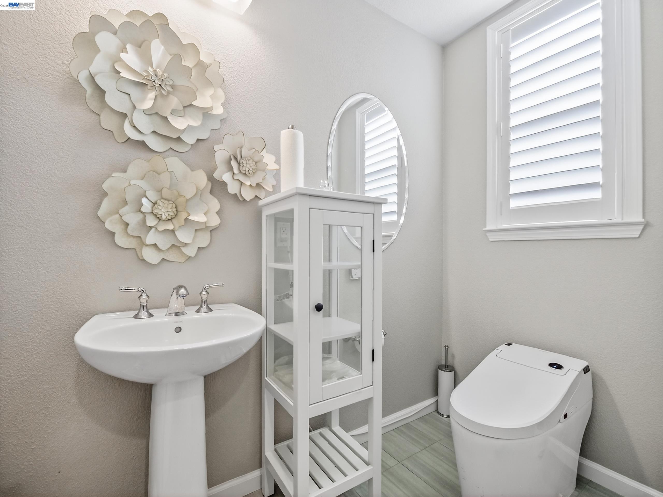 5030 Brook Valley Loop San Jose, CA 95136 - Photo 16 of 37 a bathroom with a sink a toilet and a mirror