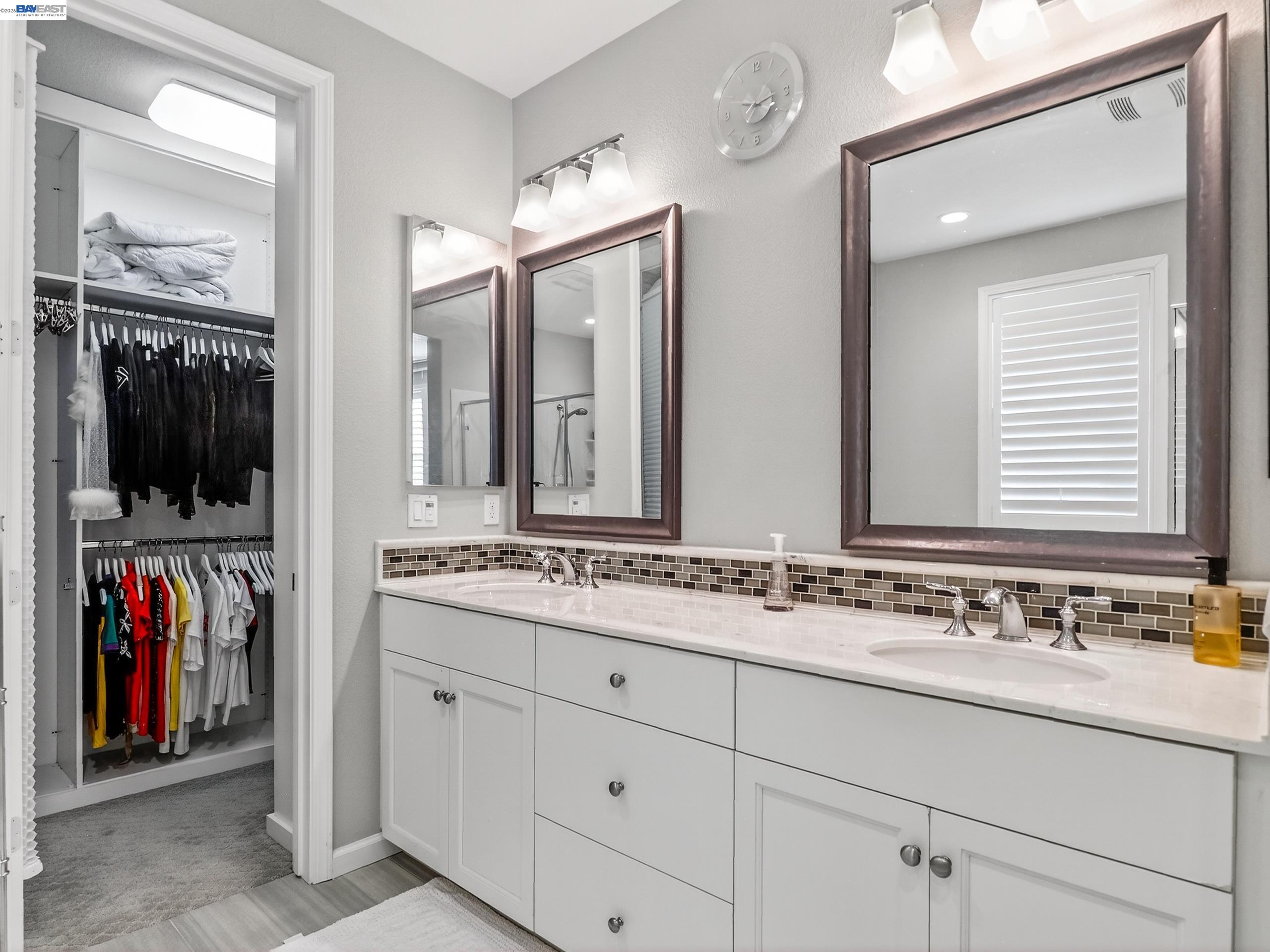 5030 Brook Valley Loop San Jose, CA 95136 - Photo 22 of 37 a bathroom with a sink and a mirror