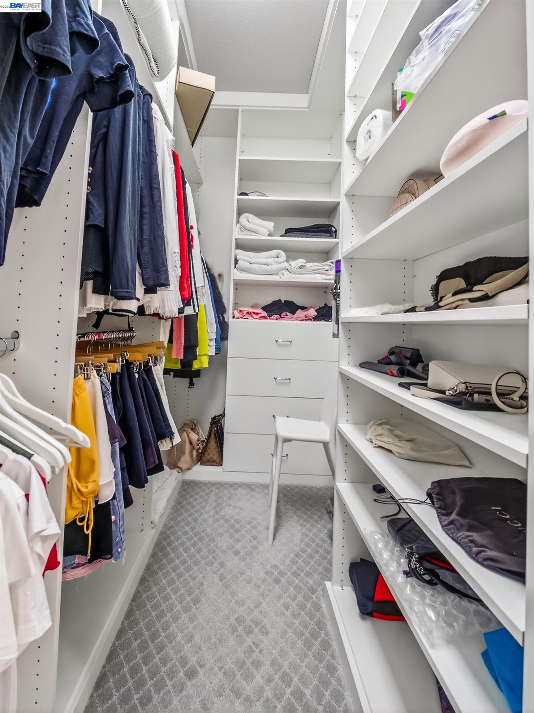 5030 Brook Valley Loop San Jose, CA 95136 - Photo 23 of 37 a view of walk in closet with clothes and shoes