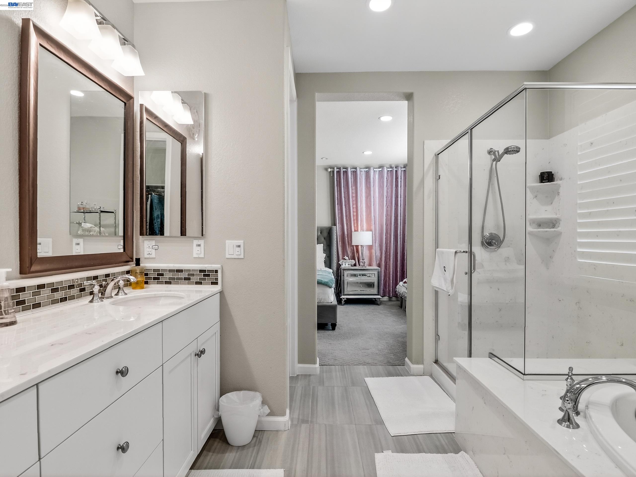 5030 Brook Valley Loop San Jose, CA 95136 - Photo 24 of 37 a bathroom with a double vanity sink mirror and shower