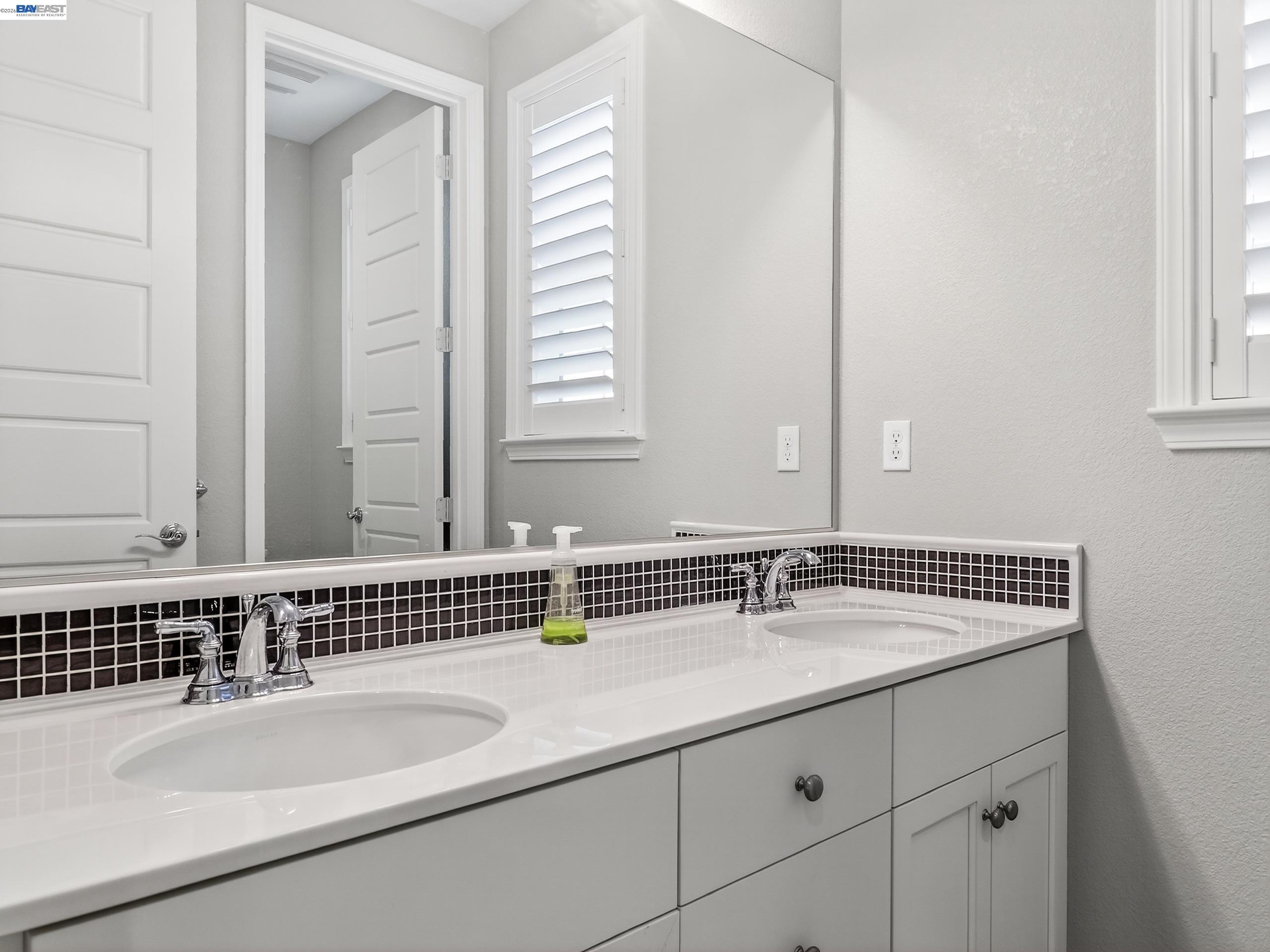 5030 Brook Valley Loop San Jose, CA 95136 - Photo 28 of 37 a bathroom with a sink and a mirror