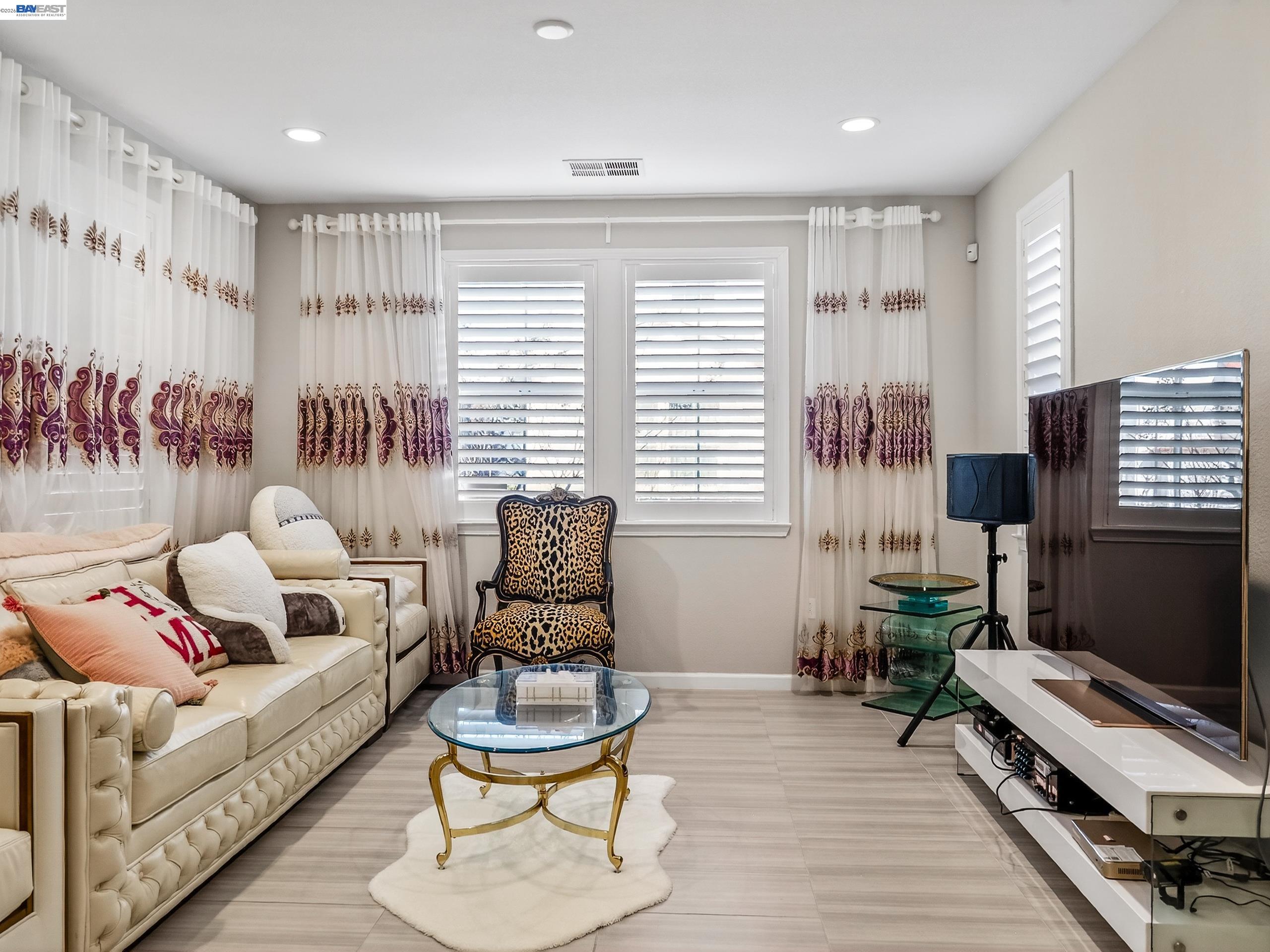 5030 Brook Valley Loop San Jose, CA 95136 - Photo 4 of 37 a living room with furniture and a fireplace