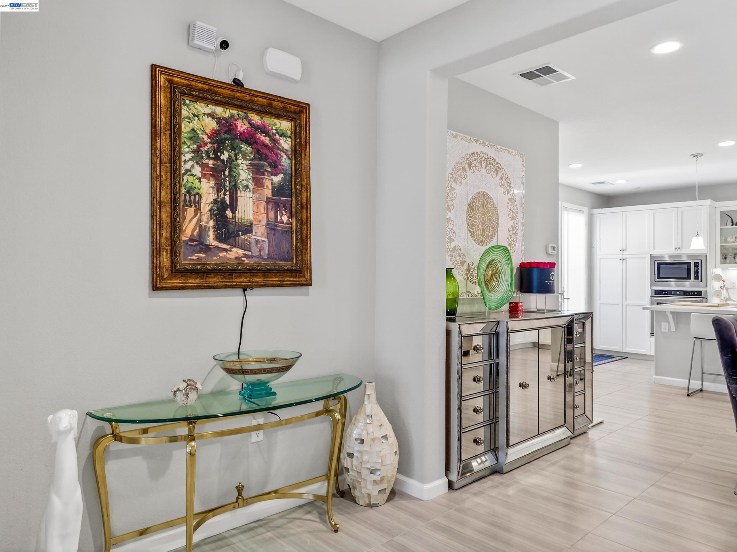 5030 Brook Valley Loop San Jose, CA 95136 - Photo 6 of 37 a view of a hallway with painting on the wall and a window