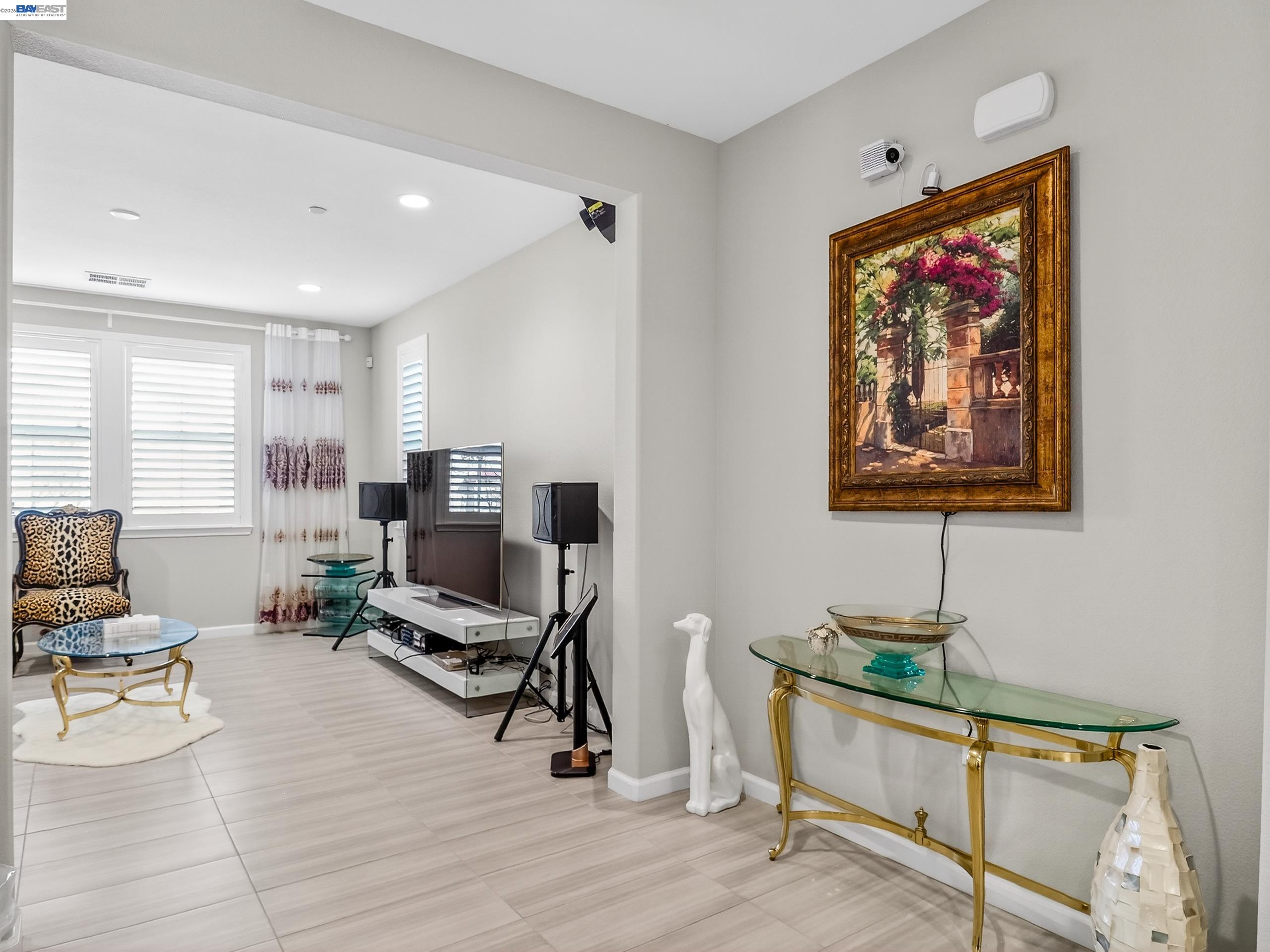 5030 Brook Valley Loop San Jose, CA 95136 - Photo 7 of 37 a living room with furniture a rug and a painting on the wall