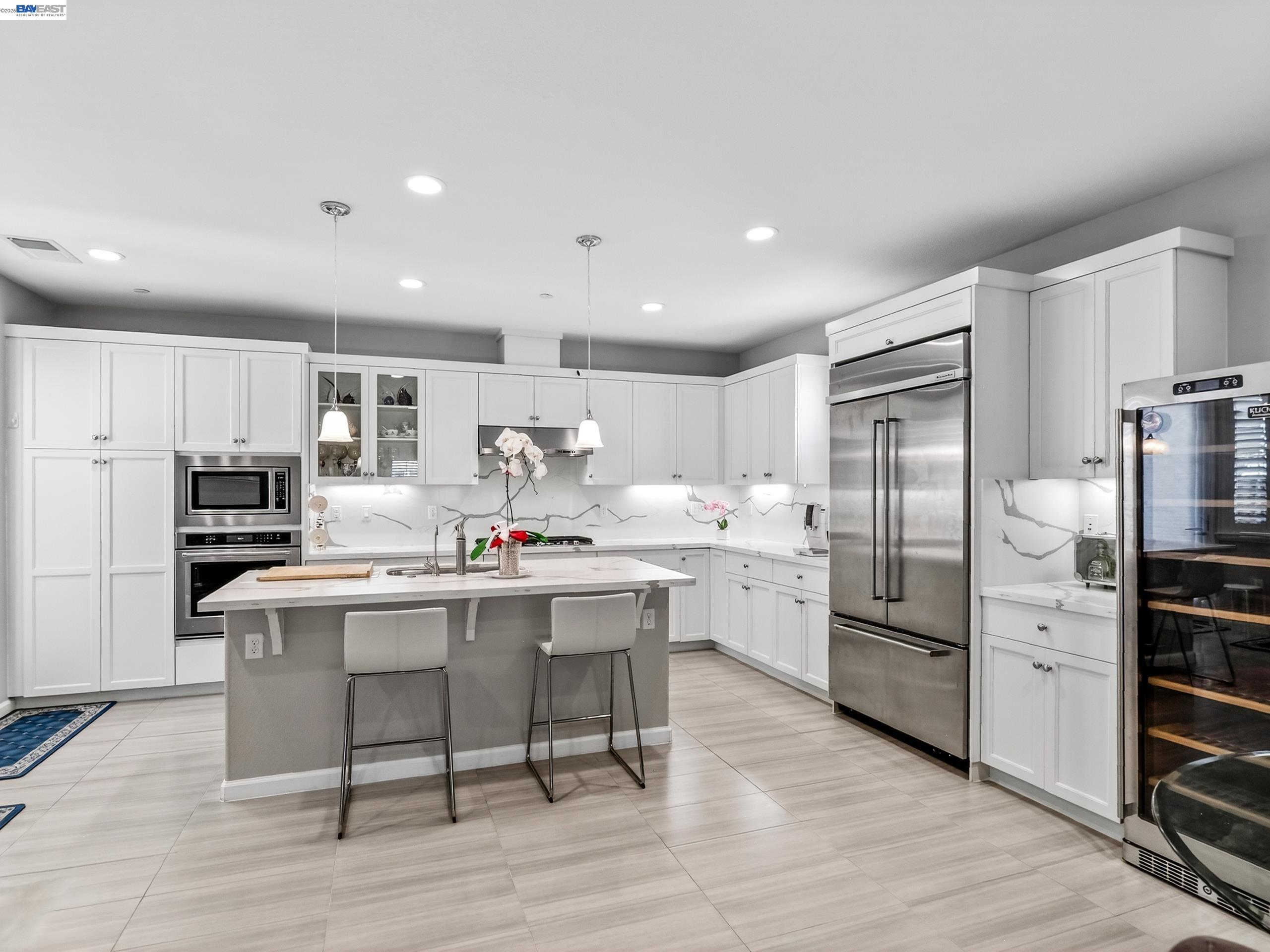 5030 Brook Valley Loop San Jose, CA 95136 - Photo 10 of 37 a kitchen with cabinets and stainless steel appliances