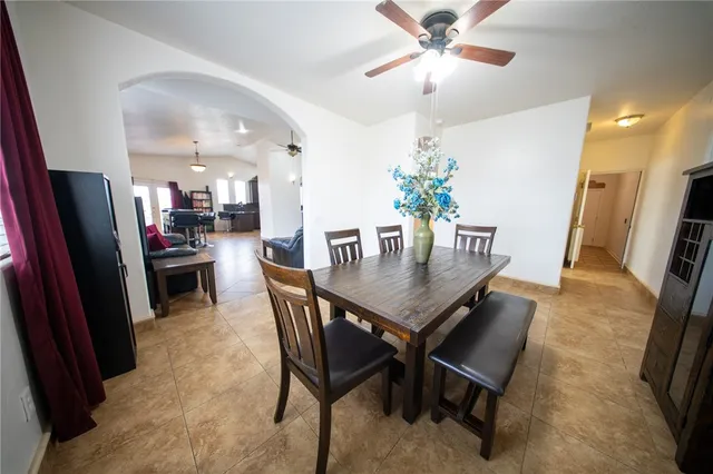 a dining room with furniture and window