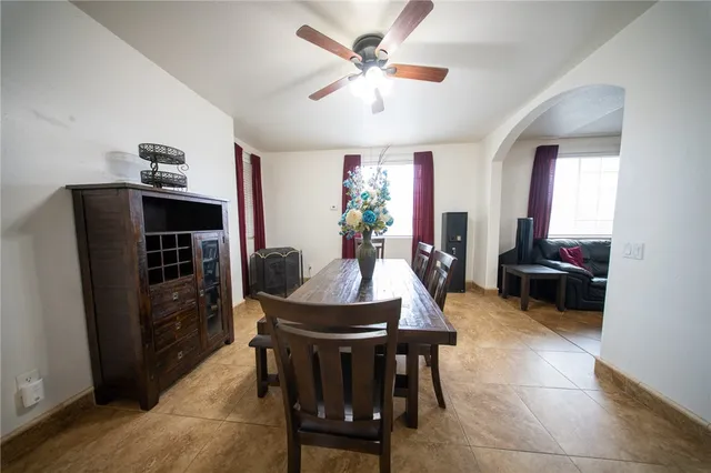 a dining room with furniture and window