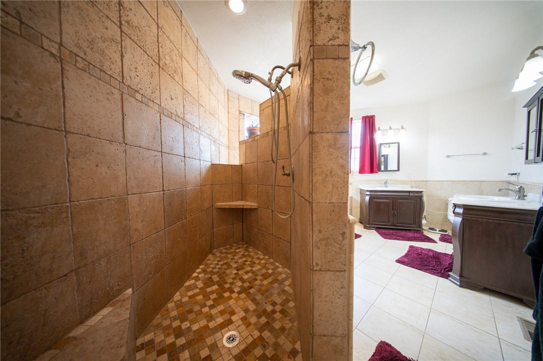 19701 Dovetail Court Tehachapi, CA 93561 - Photo 17 of 44 a bathroom with a sink and mirror