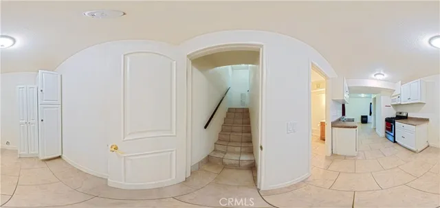 a kitchen with granite countertop a sink and a stove top oven