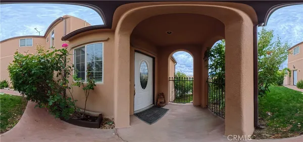 a view of a two room with large windows