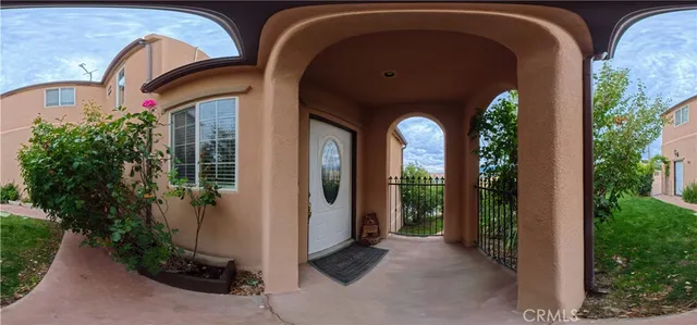 a view of a two room with large windows