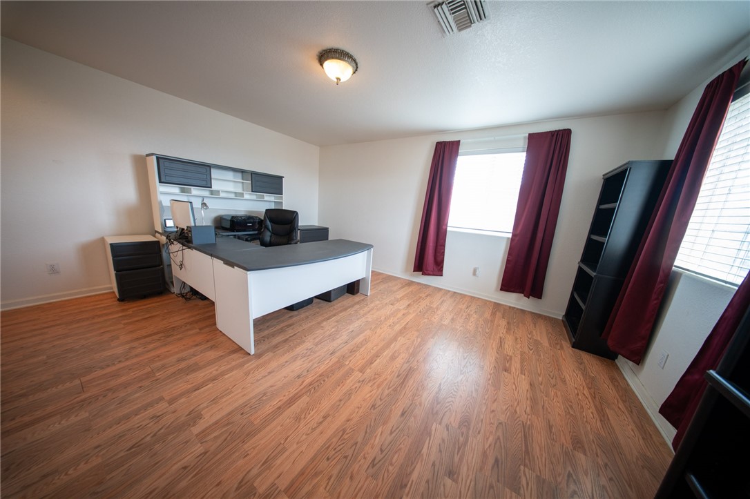 19701 Dovetail Court Tehachapi, CA 93561 - Photo 32 of 44 a living room with furniture and a wooden floor