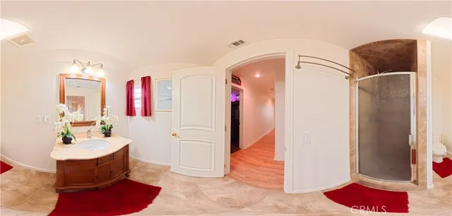 a view of a room with wooden floor