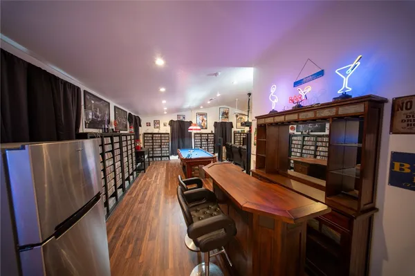 a view of a livingroom with furniture and a ceiling fan