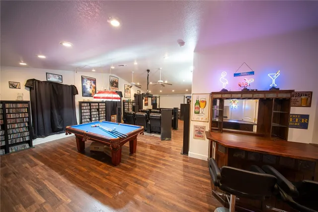 a living room with lots of furniture and a wooden floor