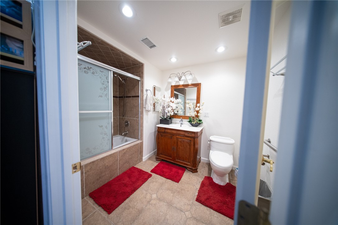 19701 Dovetail Court Tehachapi, CA 93561 - Photo 41 of 44 a bathroom with a bathtub shower sink and toilet