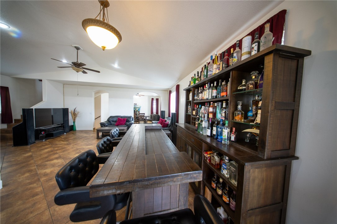 19701 Dovetail Court Tehachapi, CA 93561 - Photo 8 of 44 a living room with furniture a window and bookshelf