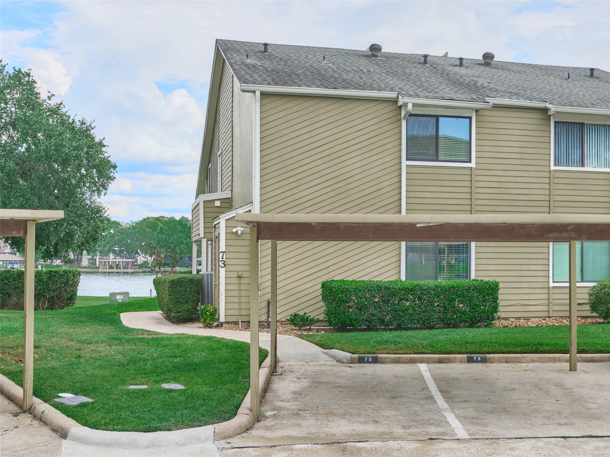 73 April Point Drive South Montgomery, TX 77356 - Photo 40 of 42 Unit features 2 covered parking spaces along with additional guest parking.