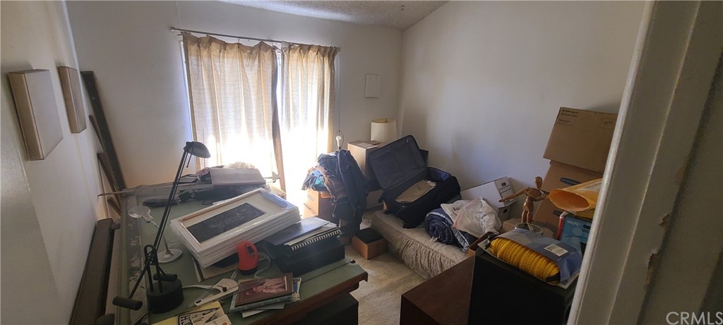 1192 Mitchell Avenue, Unit 7 Tustin, CA 92780 - Photo 11 of 16 a room with furniture and a window