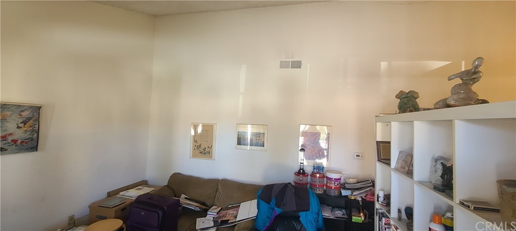 1192 Mitchell Avenue, Unit 7 Tustin, CA 92780 - Photo 4 of 16 a living room with furniture and a flat screen tv