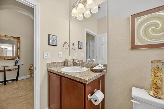 a living room with furniture and a flat screen tv with wooden floor