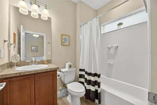 a view of walk in closet with clothes