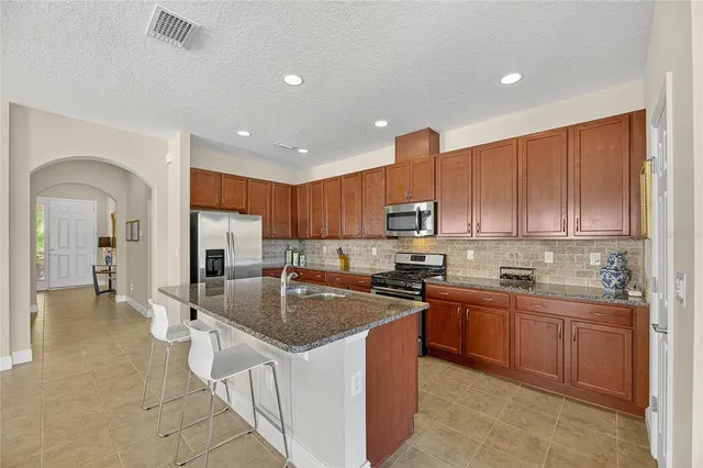 an aerial view of house with yard swimming pool and outdoor seating