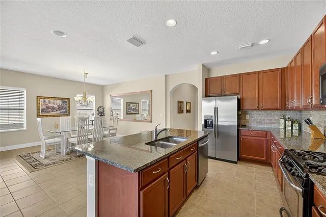 an aerial view of residential houses with outdoor space and river view