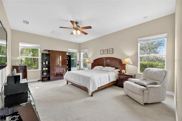 an aerial view of residential house with an outdoor space and seating area