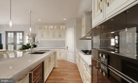 a kitchen with stainless steel appliances a sink a stove top oven a counter space and cabinets