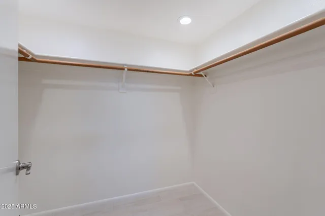 a view of a room with shelf on the wall