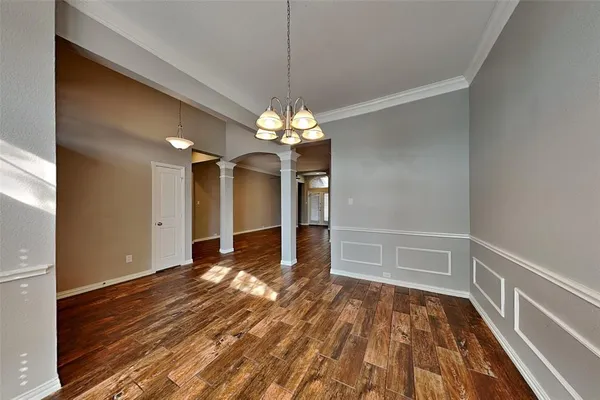 a view of a livingroom with wooden floor