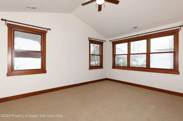 a view of an empty room with a window