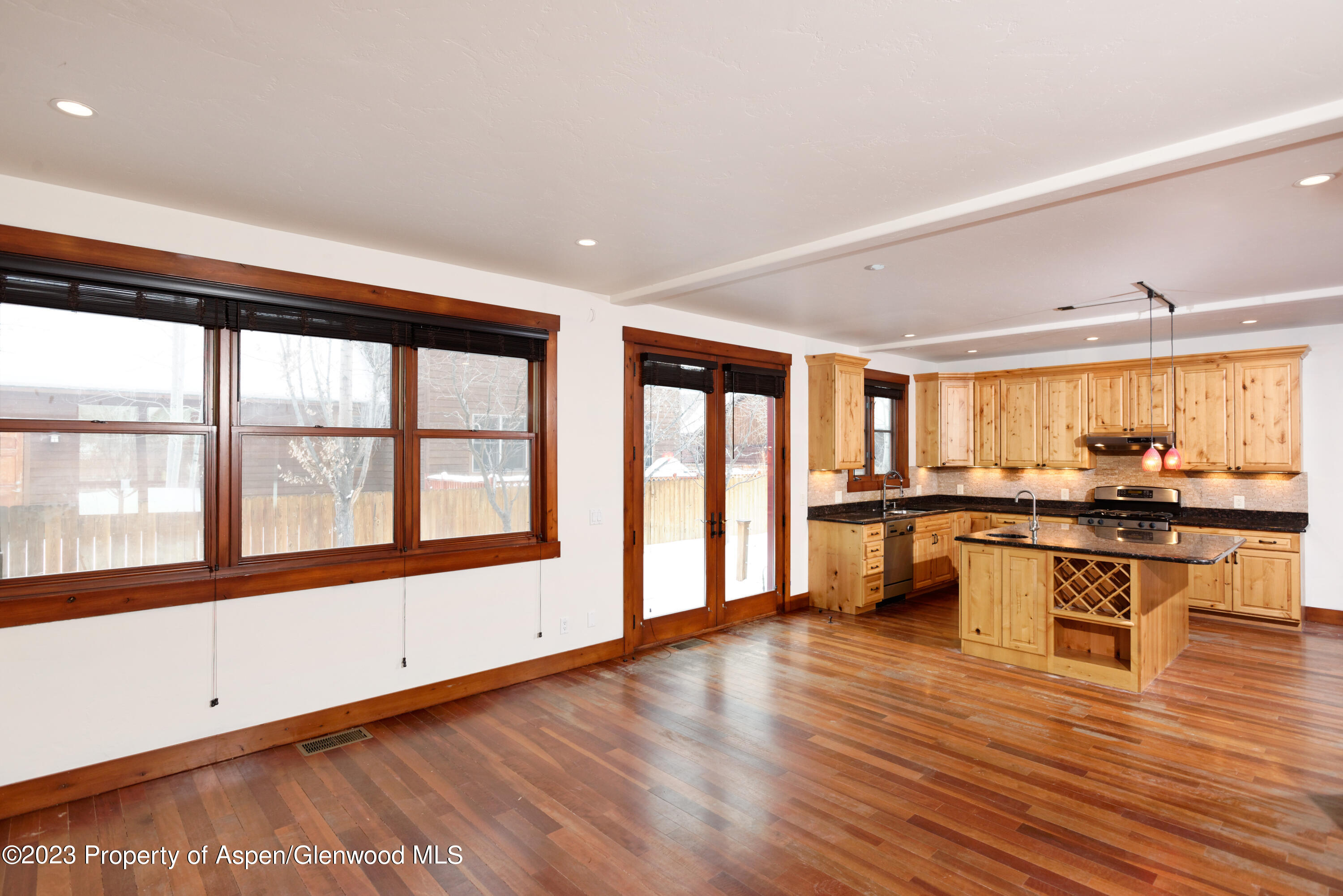 210 Juniper Court Basalt, CO 81621 - Photo 9 of 18 a large white kitchen with stainless steel appliances granite countertop a stove and a large window