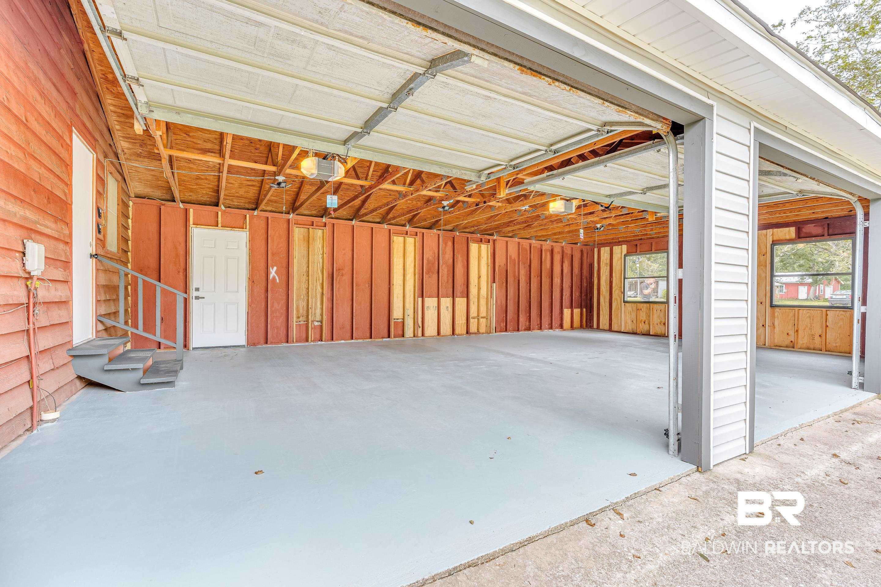 8001 16th Street Irvington, AL 36544 - Photo 25 of 35 Garage with a garage door opener