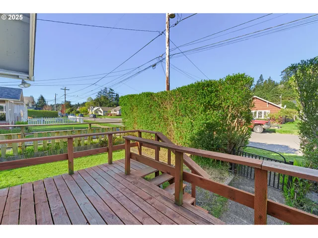 a view of a wooden deck with a bench
