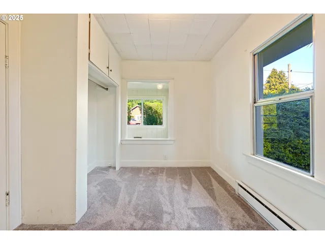 a view of an empty room and window